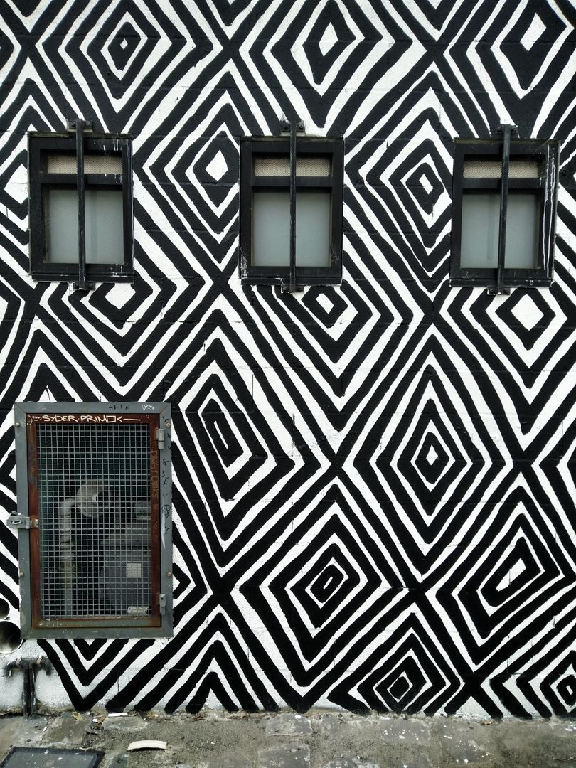 Geometric Black and White Wall with Windows and Vent - Free Images, Stock Photos and Pictures on Pikwizard.com