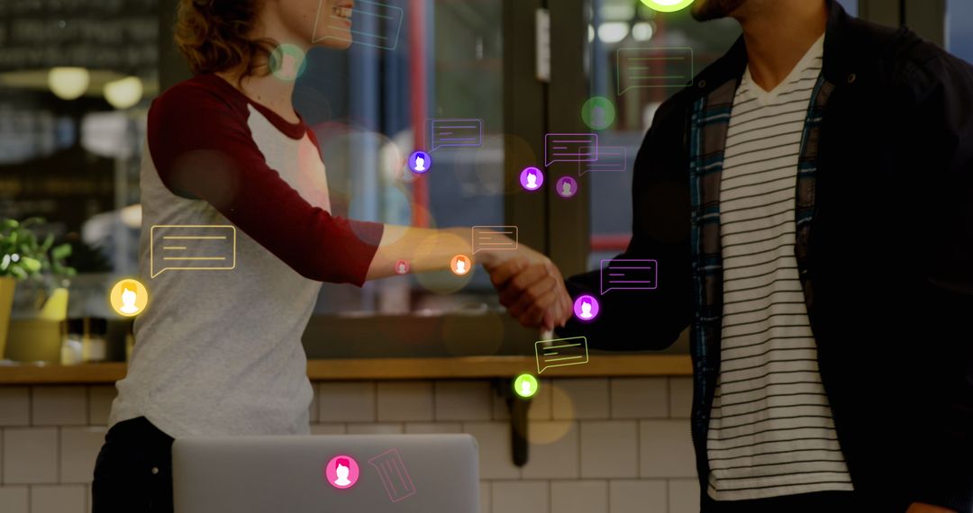 Business Professionals Shaking Hands with Digital Interface Icons