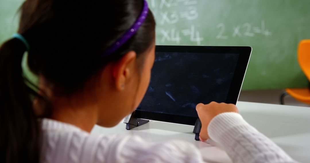 Young Student Using Digital Tablet in Classroom - Free Images, Stock Photos and Pictures on Pikwizard.com