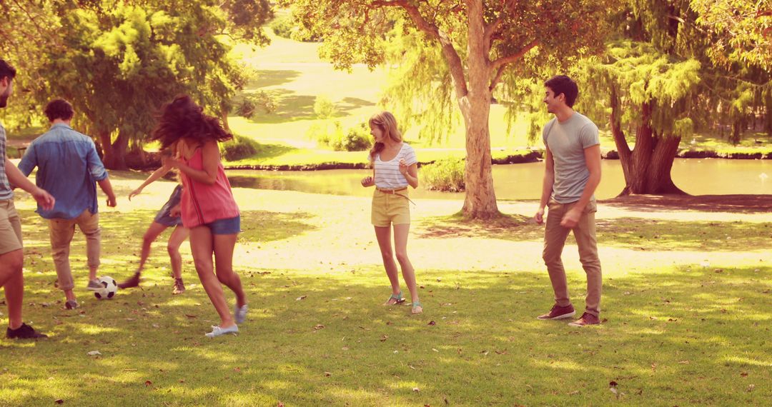 Group of Friends Enjoying Recreation in Park on a Sunny Day - Free Images, Stock Photos and Pictures on Pikwizard.com