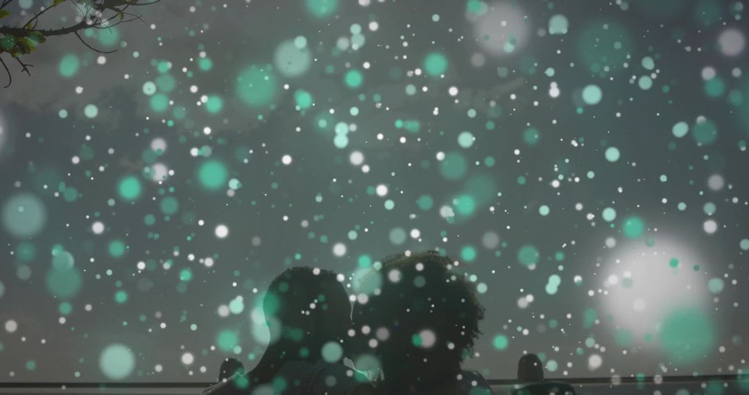 Couple Enjoying Snowfall on Nighttime Park Bench