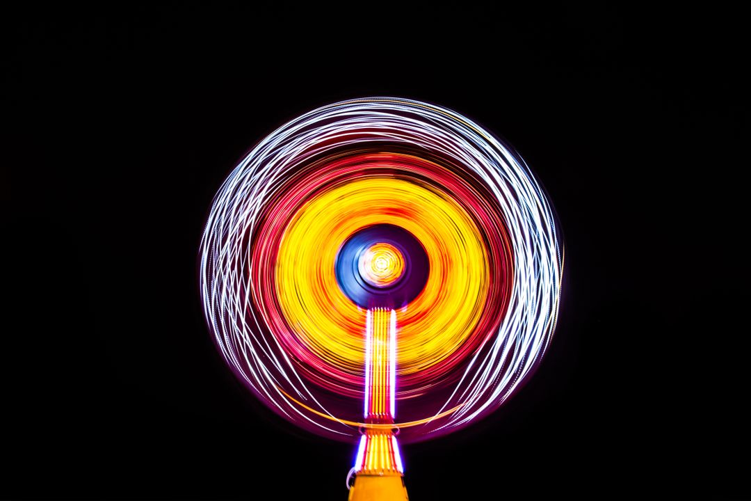 Colorful Motion Blur of Spinning Wind Fan on Black Background - Free Images, Stock Photos and Pictures on Pikwizard.com