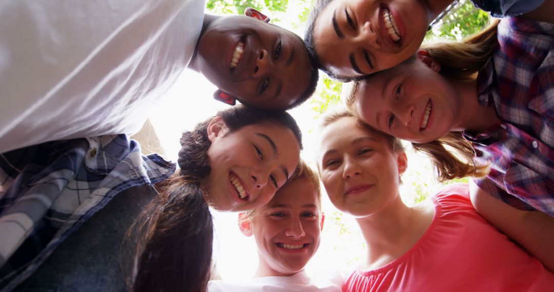 Diverse Group of Teens Smiling in a Circle Outdoors - Free Images, Stock Photos and Pictures on Pikwizard.com