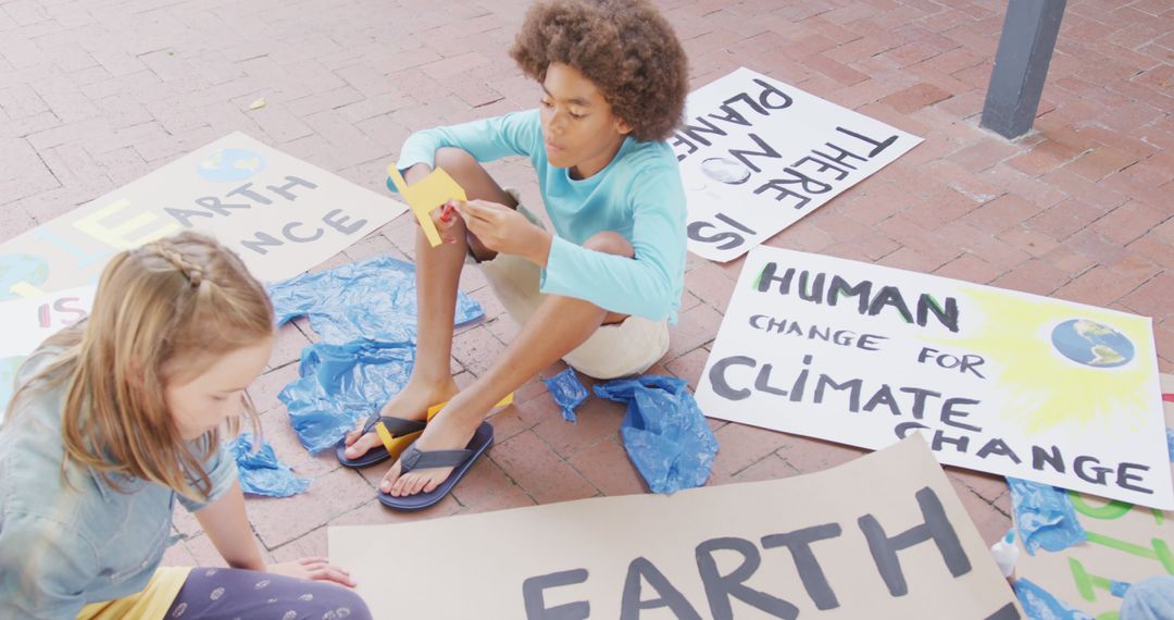 Children Creating Protest Signs for Climate Change Awareness - Free Images, Stock Photos and Pictures on Pikwizard.com