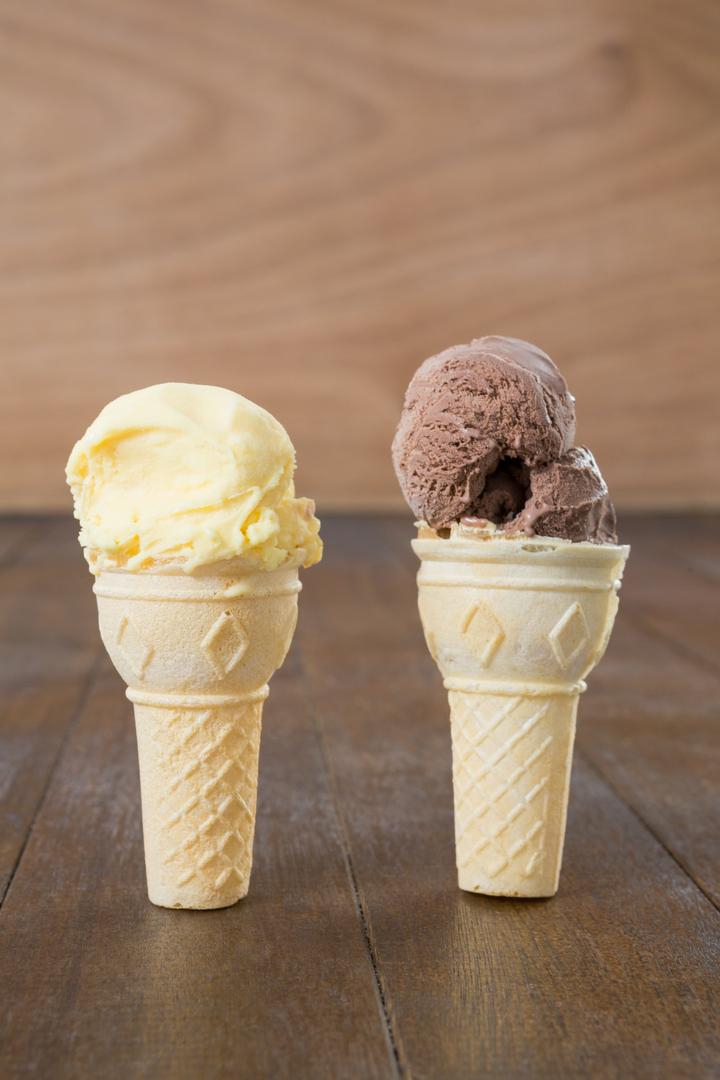 Chocolate and Vanilla Ice Cream Cones on Wooden Surface - Free Images, Stock Photos and Pictures on Pikwizard.com