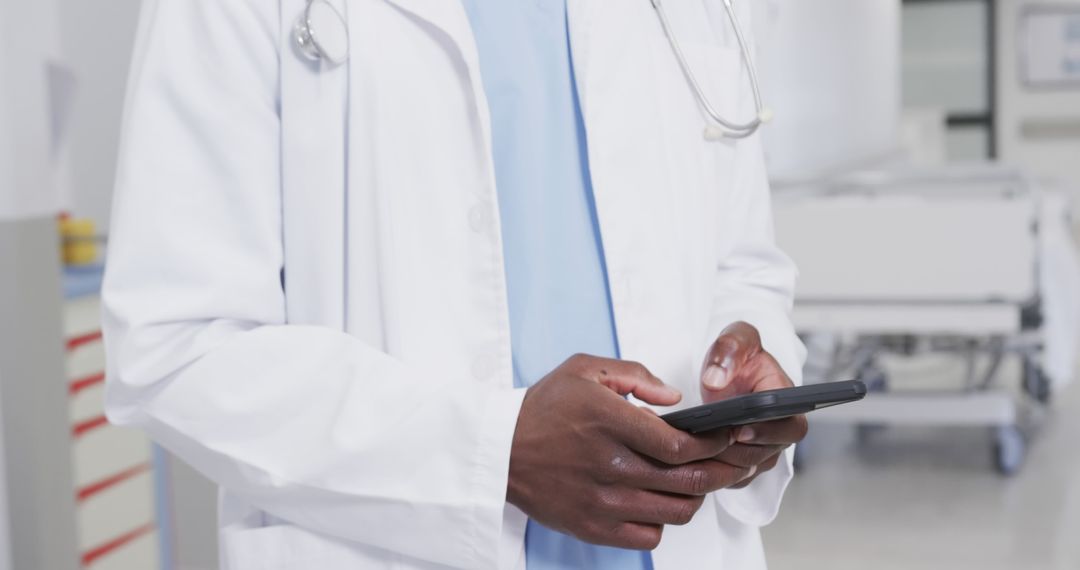 Doctor Using Smartphone in Hospital Ward - Free Images, Stock Photos and Pictures on Pikwizard.com