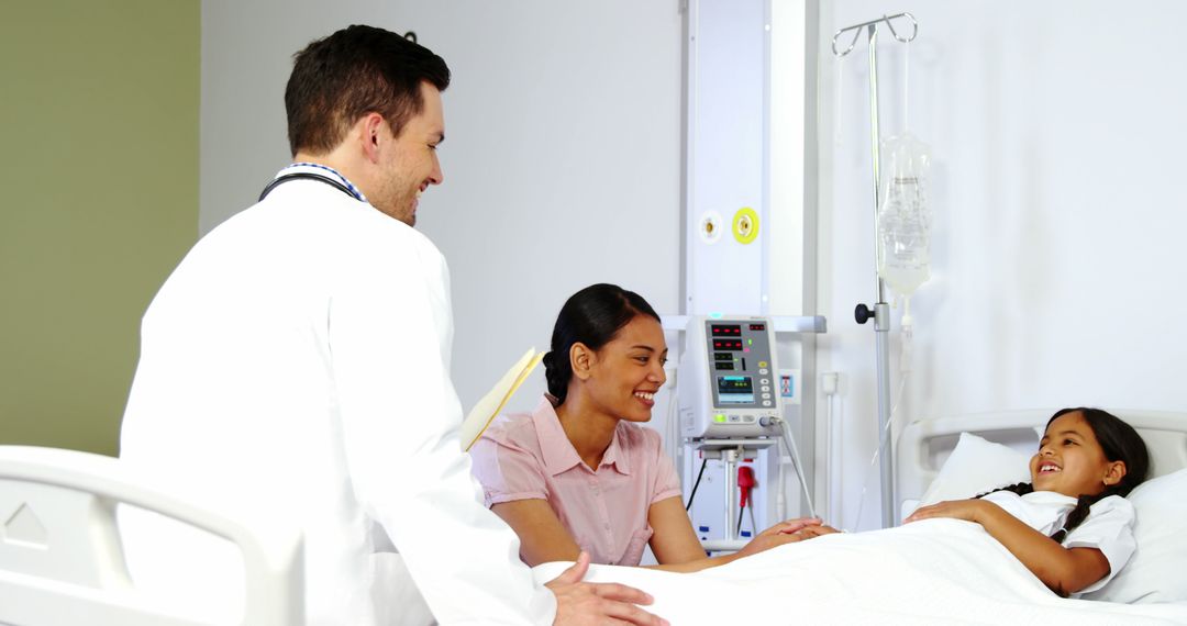 Doctor Speaking with Parent and Child Patient in Hospital Bed - Free Images, Stock Photos and Pictures on Pikwizard.com