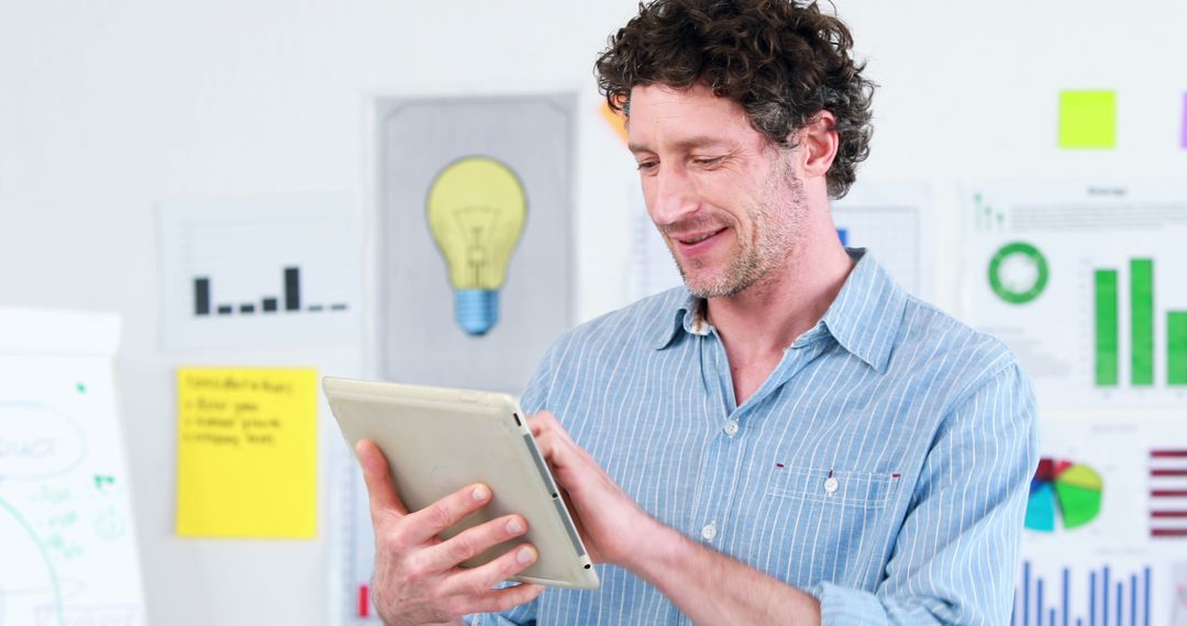 Creative Professional Using Tablet in Modern Office Setting