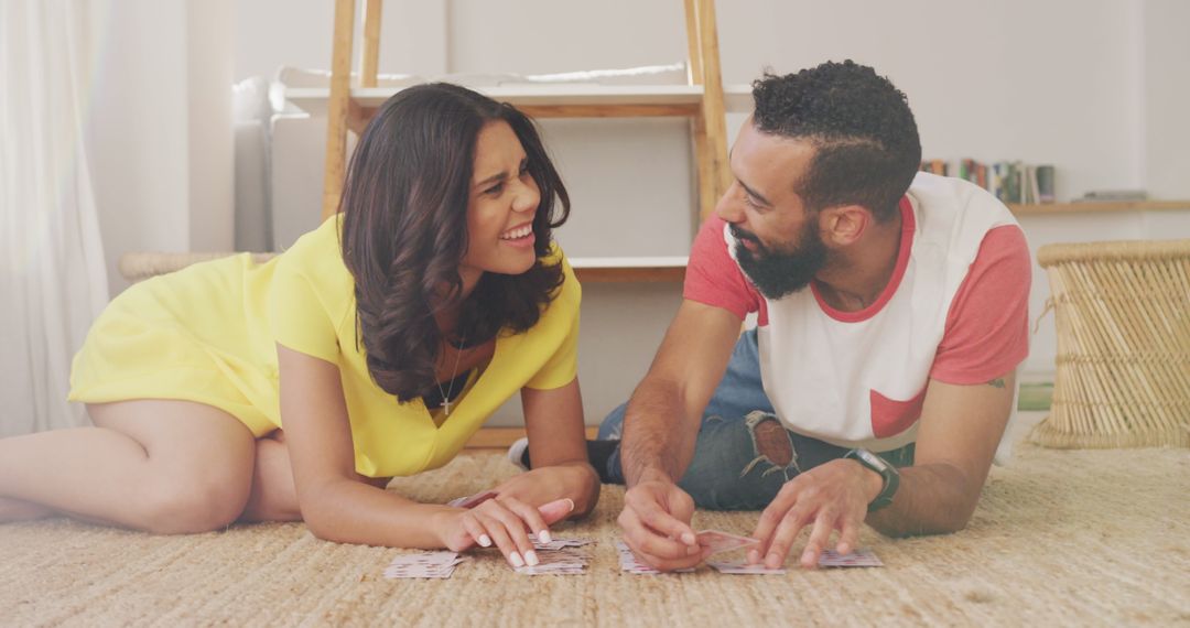 Couple Enjoying Card Game at Home Relaxing on Weekend