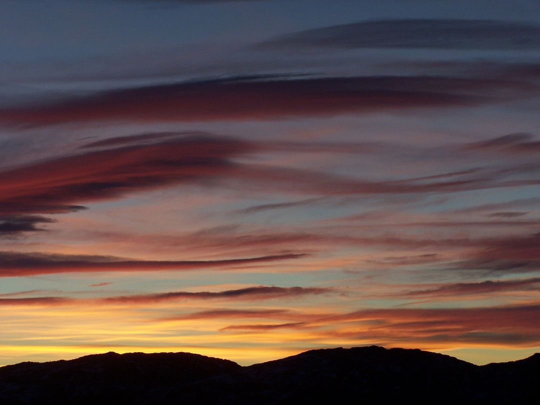 Panoramic Silhouette of Mountains Under Stunning Sunset Sky - Free Images, Stock Photos and Pictures on Pikwizard.com