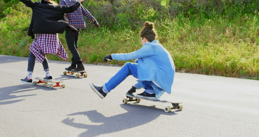 Group of Teenagers Skateboarding Together Outdoors on Sunny Day - Free Images, Stock Photos and Pictures on Pikwizard.com