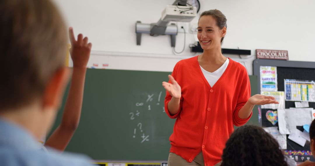 Engaging Female Teacher in Classroom Interacting with Students