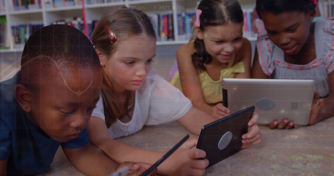 Diverse Children Studying with Tablets Overlaid with Graph Representations