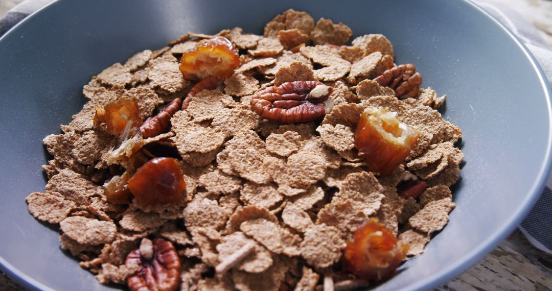 Healthy Breakfast Bowl with Bran Flakes, Dates, and Pecans - Free Images, Stock Photos and Pictures on Pikwizard.com