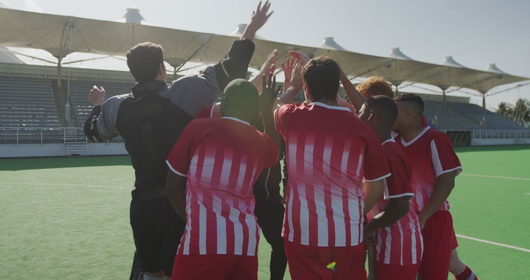 Soccer Team Celebrating Victory with Raised Hands - Free Images, Stock Photos and Pictures on Pikwizard.com