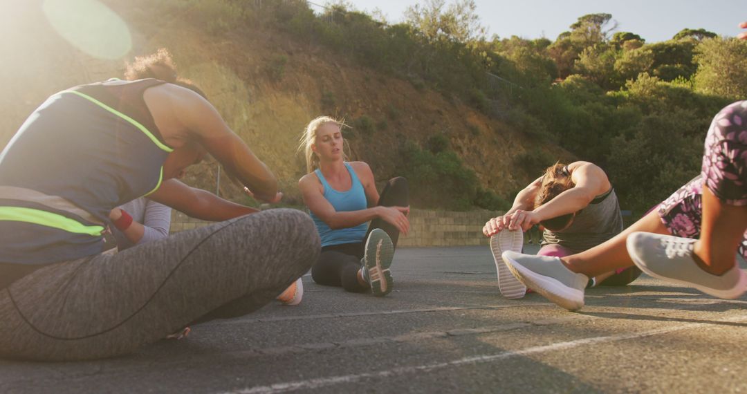 Group of Women Stretching Together Outdoors Before Workout - Free Images, Stock Photos and Pictures on Pikwizard.com