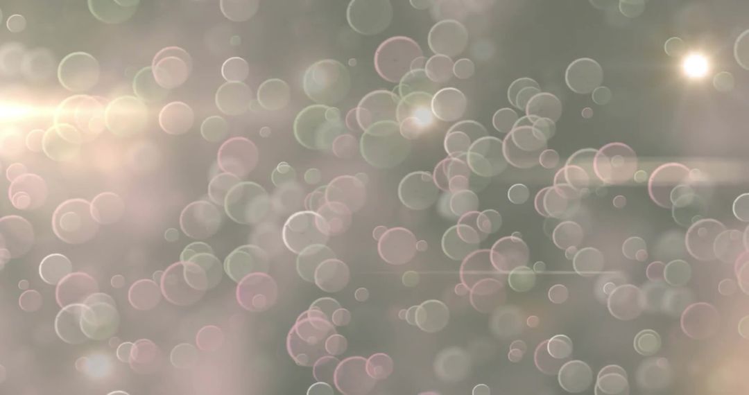 Soft Bokeh Lights with Glowing Circles Over Blurred Background