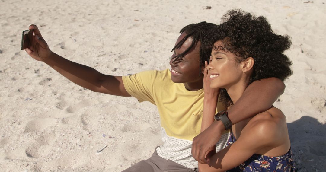 Happy Couple Taking a Selfie on Sandy Beach - Free Images, Stock Photos and Pictures on Pikwizard.com