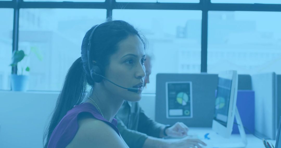 Female Call Center Agent Discussing with Colleague in Office