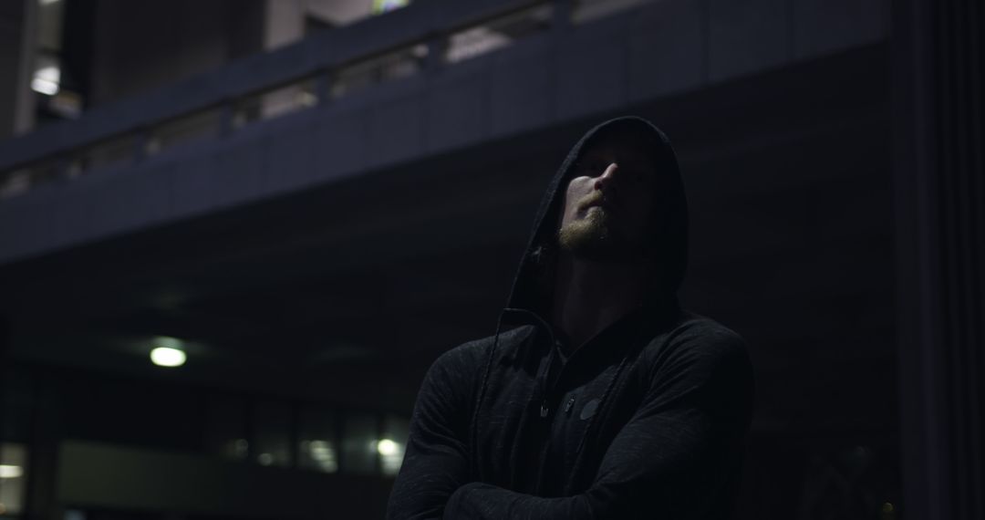 Mysterious Man in Hoodie at Nighttime Location - Free Images, Stock Photos and Pictures on Pikwizard.com