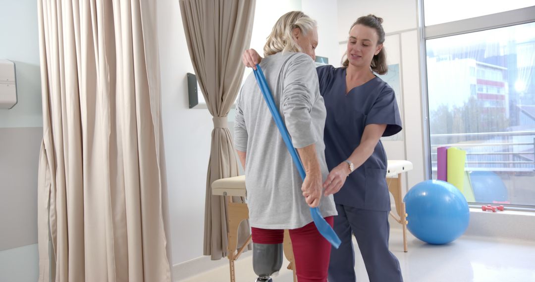 Female Unrecognizable Physiotherapist Assisting Senior Woman with Resistance Band Exercises - Free Images, Stock Photos and Pictures on Pikwizard.com