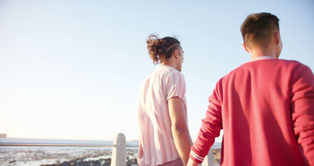 Young Couple Holding Hands Near Ocean - Free Images, Stock Photos and Pictures on Pikwizard.com