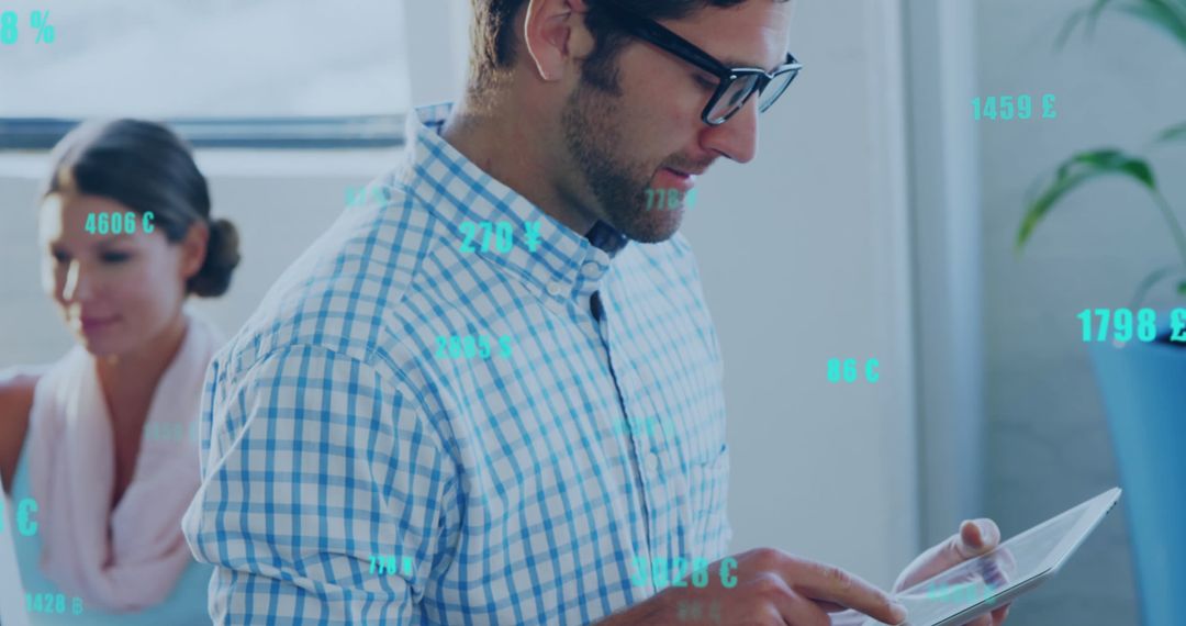 Businessman Analyzing Data on Digital Tablet with Currency Symbols Overlay