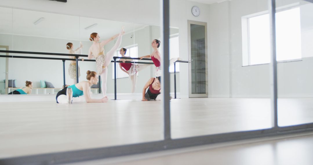 Group of Ballet Dancers Practicing in Dance Studio with Mirrors - Free Images, Stock Photos and Pictures on Pikwizard.com