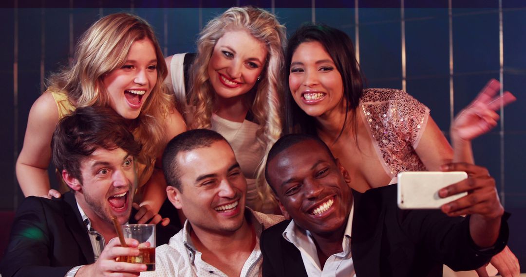 Diverse Friends Smiling and Posing for a Celebration Selfie