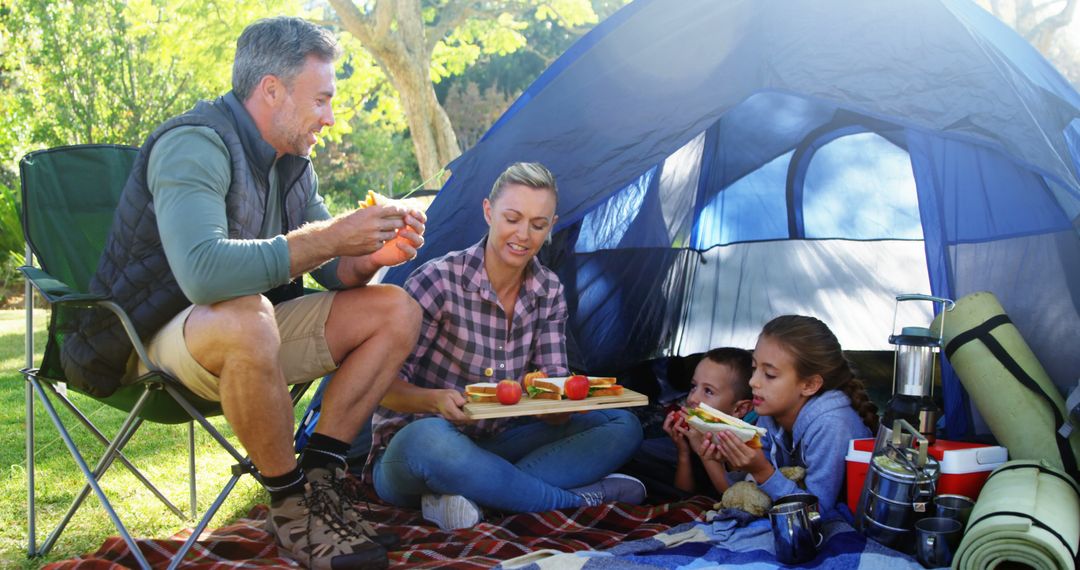 Family Enjoying Camping Outdoor Together - Free Images, Stock Photos and Pictures on Pikwizard.com