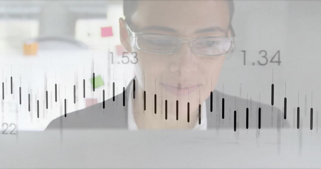 Professional Woman Analyzing Financial Data on Computer Monitor