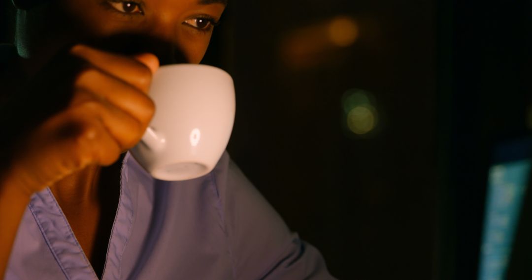 African American Woman Drinking Coffee at Night - Free Images, Stock Photos and Pictures on Pikwizard.com