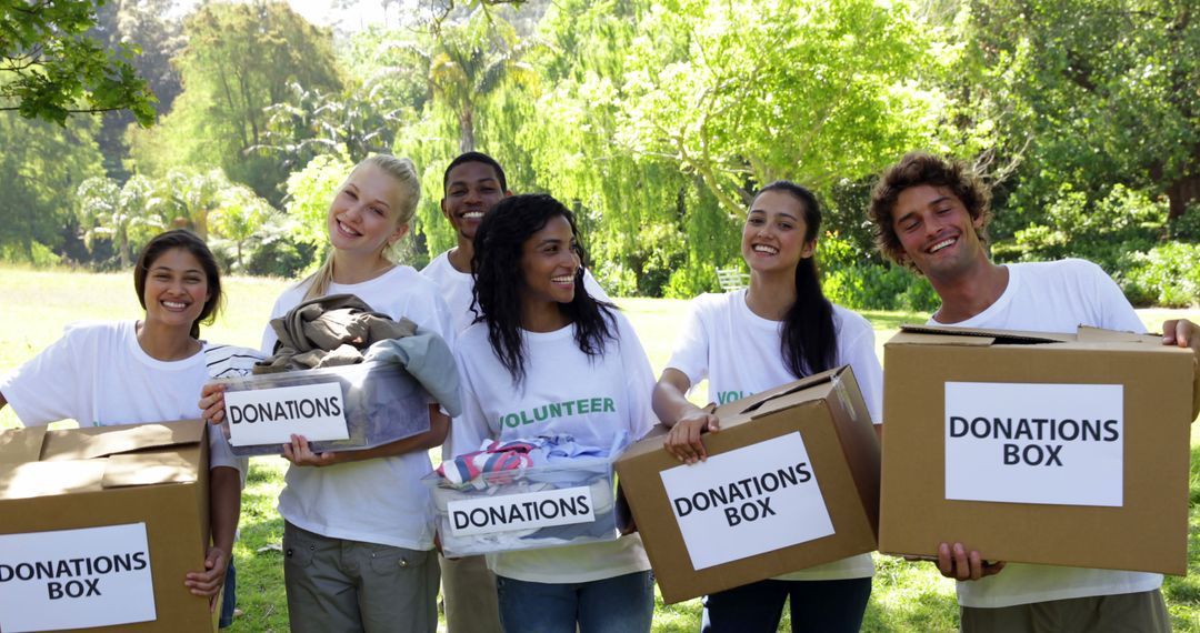 Diverse Group of Volunteers Collecting Donations Outdoors - Free Images, Stock Photos and Pictures on Pikwizard.com