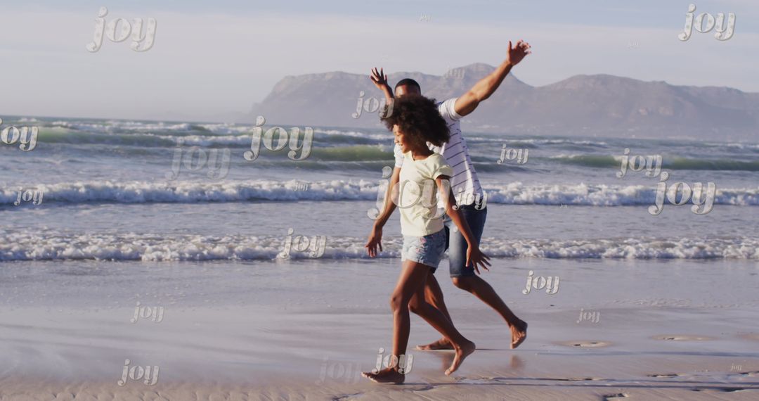 Father and Daughter Walking on Sunny Beach Overjoyed