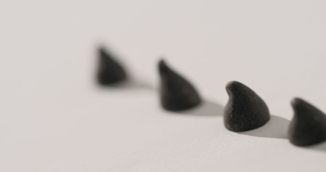 Close-up Focus on Dark Chocolate Chips on White Background