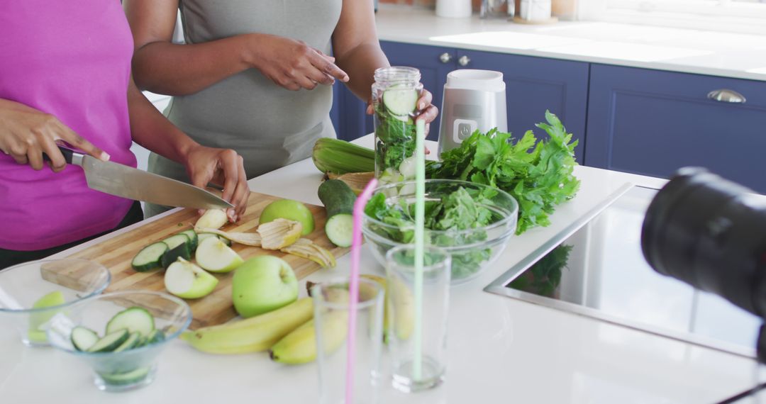 Women Preparing Healthy Green Smoothie in Modern Kitchen - Free Images, Stock Photos and Pictures on Pikwizard.com