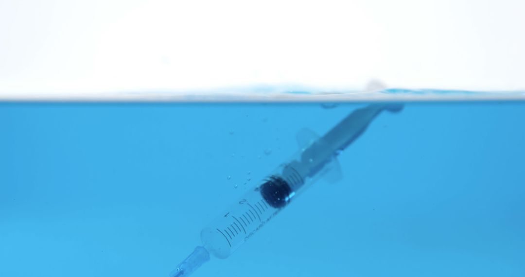 Syringe Submerged Underwater Represents Medical Concept - Free Images, Stock Photos and Pictures on Pikwizard.com