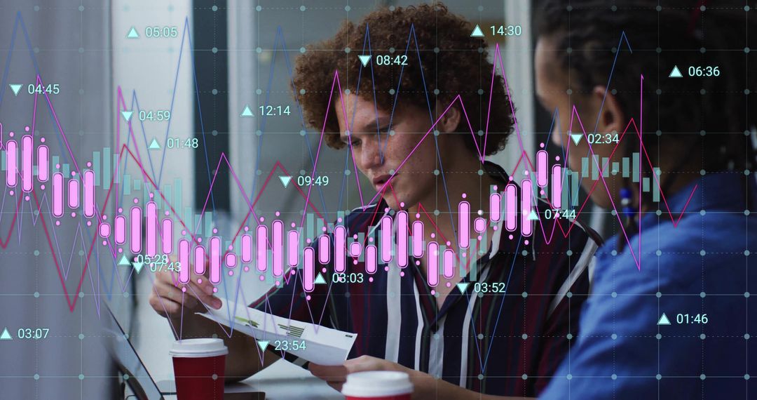 Colleagues Analyzing Data with Digital Graph Overlay in Office