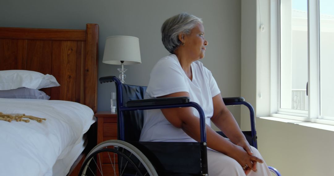 Senior Woman in Wheelchair Looking Out Window - Free Images, Stock Photos and Pictures on Pikwizard.com