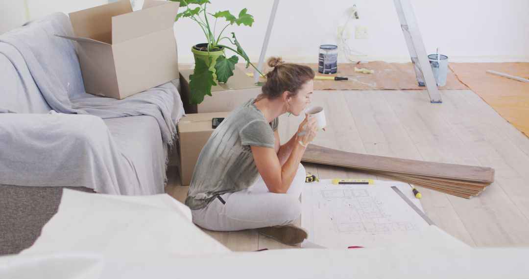 Woman Taking Coffee Break Amid Home Renovation - Free Images, Stock Photos and Pictures on Pikwizard.com