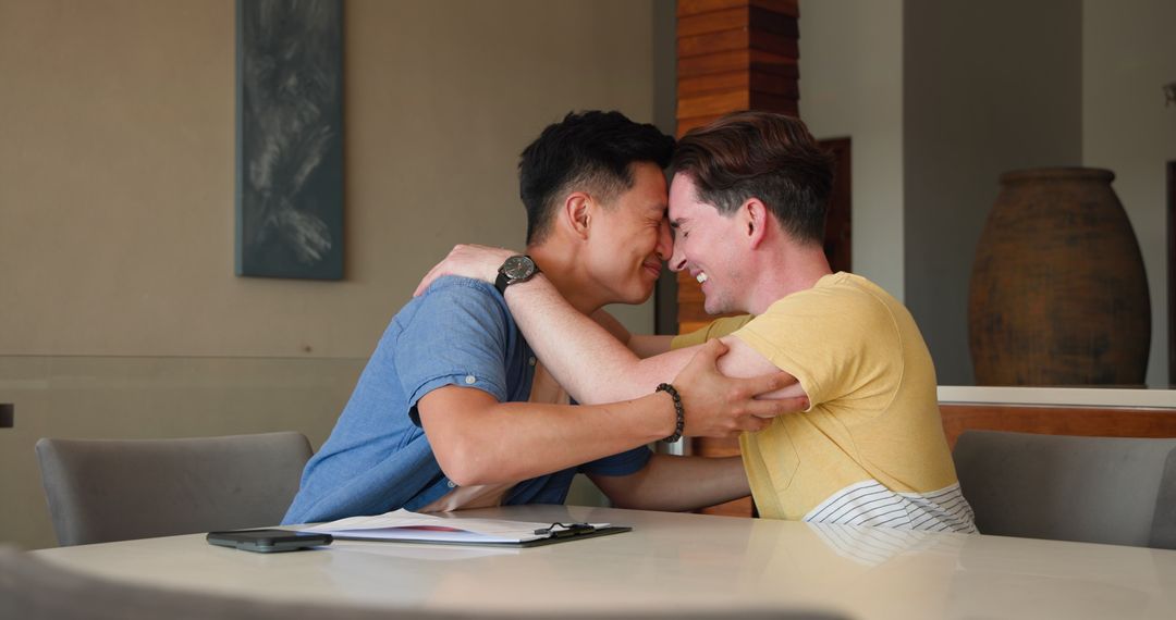 Joyful Friends Sharing Laughter and Bonding Over Table