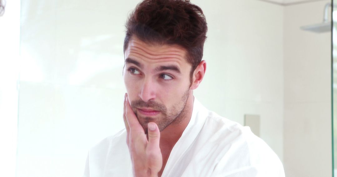 Man Examining Skin in Bathroom Mirror with Concern - Free Images, Stock Photos and Pictures on Pikwizard.com