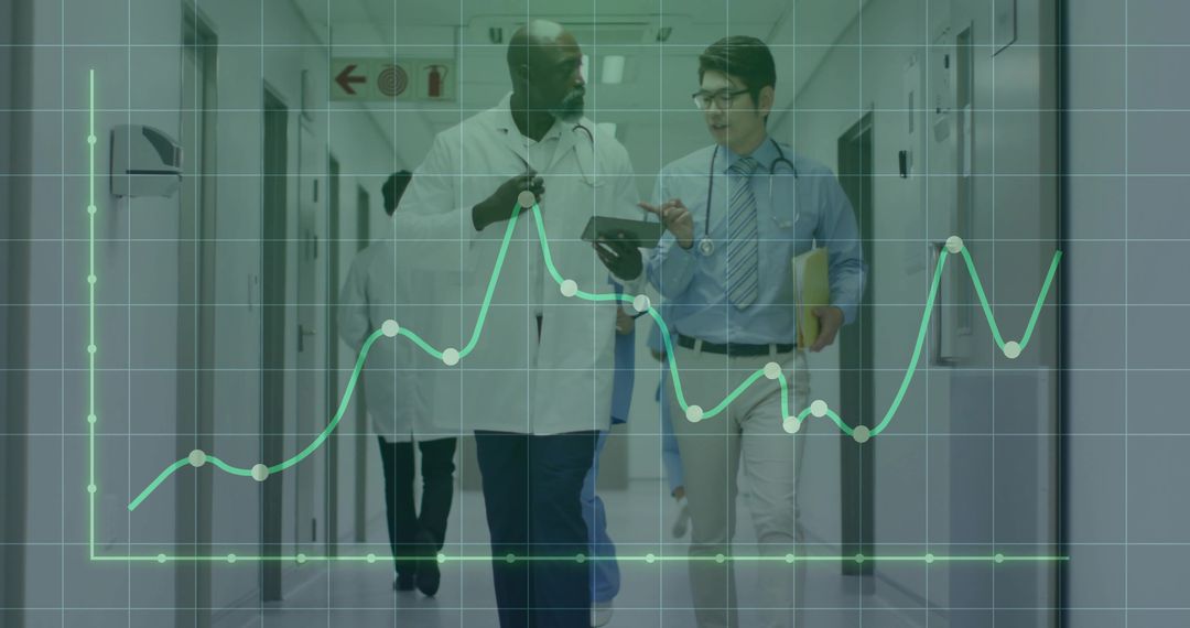 Doctors Collaborate in Hospital Corridor Analyzing Data Trends