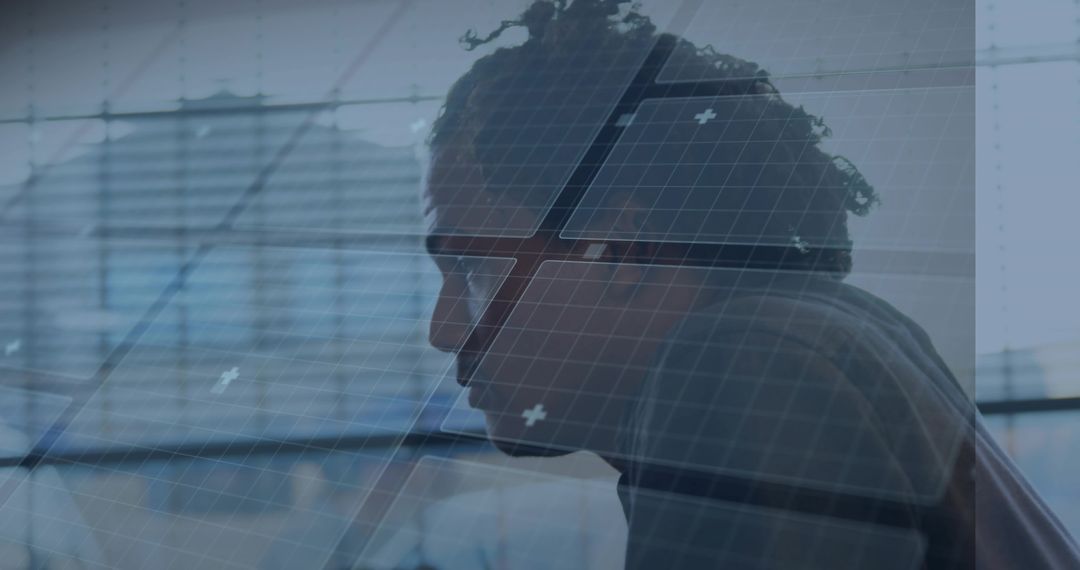 Leaning Profile Man Studying Data Overlay with Glass Reflection in Modern Office
