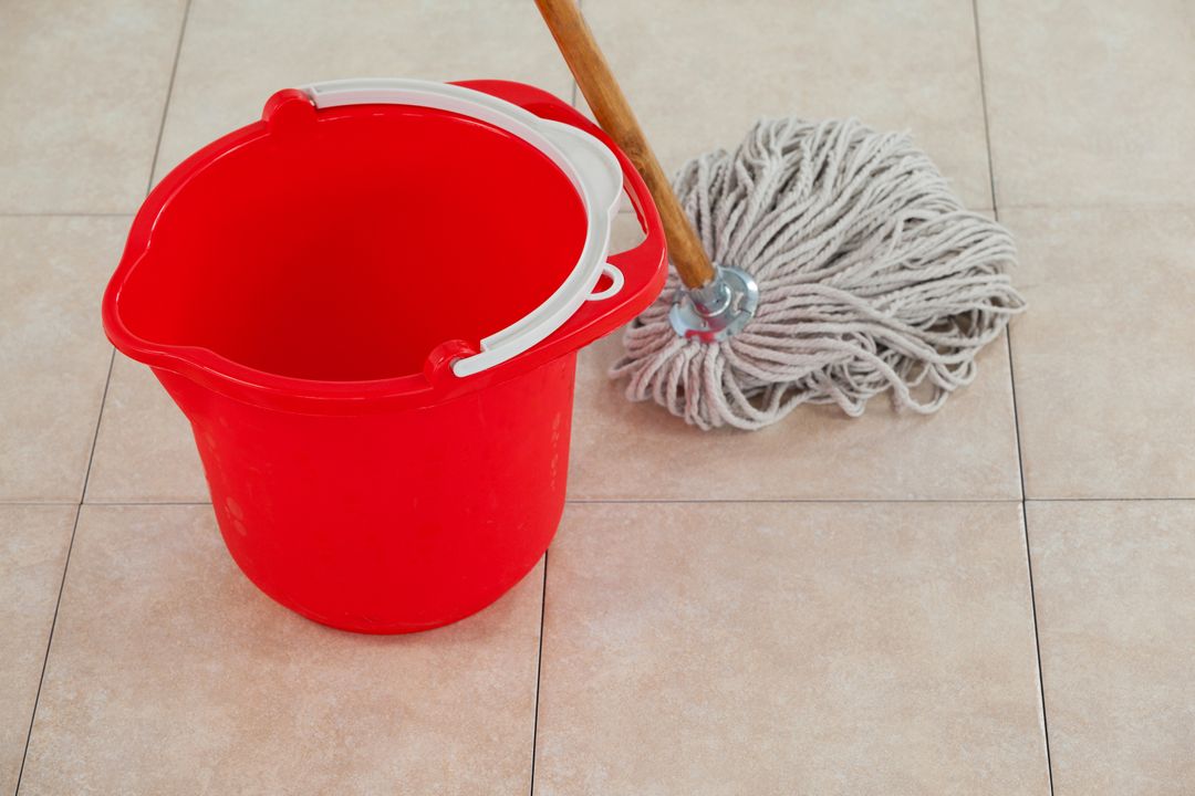 Empty Red Bucket and Mop on Tile Floor - Free Images, Stock Photos and Pictures on Pikwizard.com