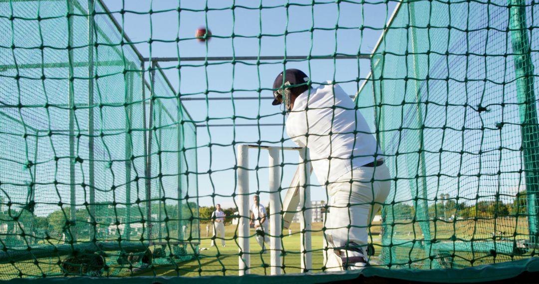 Batsman Practicing Cricket in Nets under Clear Sky - Free Images, Stock Photos and Pictures on Pikwizard.com