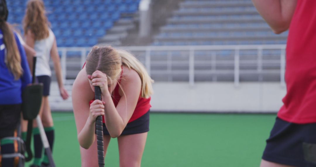 Female Field Hockey Player Resting During Training Session - Free Images, Stock Photos and Pictures on Pikwizard.com