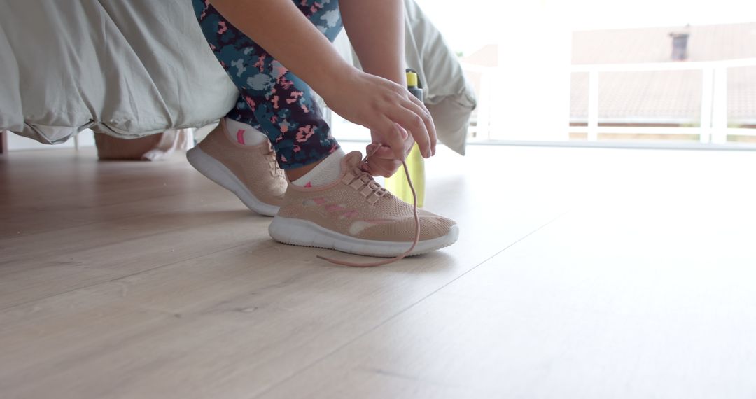 Plus-Size Woman Tying Sport Shoe for Morning Exercise Routine