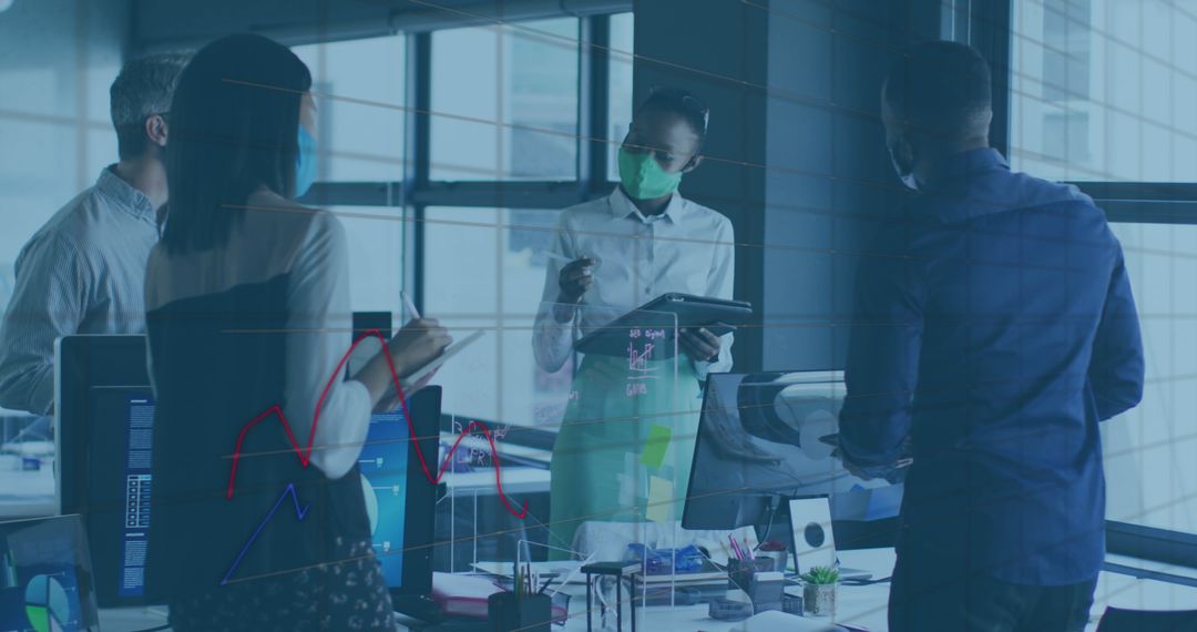 Business Team Meeting with Financial Data During Pandemic