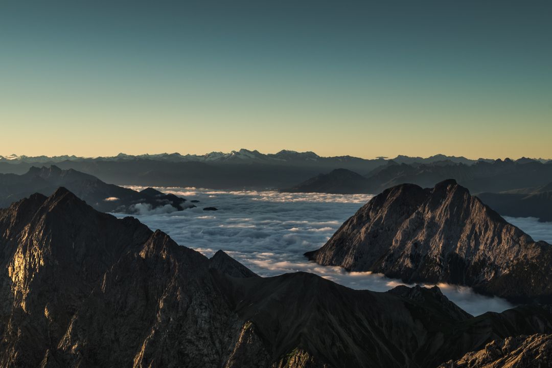 Majestic Mountain Range with Cloud Blanket at Sunrise - Free Images, Stock Photos and Pictures on Pikwizard.com